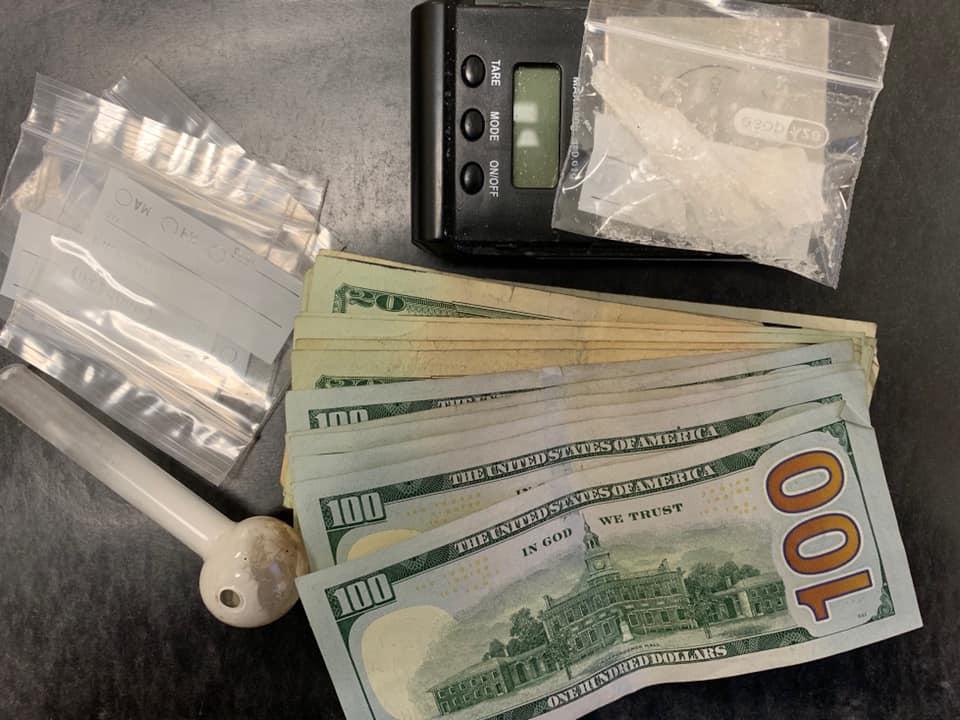 6.9 grams of methamphetamine, baggies, scales, and paraphernalia were located and $879 was seized