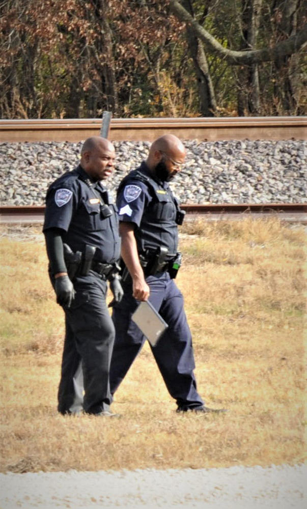 two deputies assessing the crime scene