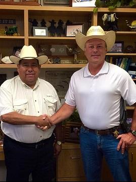 Lewis Palos shakes Sheriff Tanner's hand