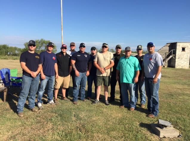Captain Stan Farmer and Sgt. Jeff Harbuck and other officers pose together after winning the 2015 Habitat For Humanity Meat and Skeet
