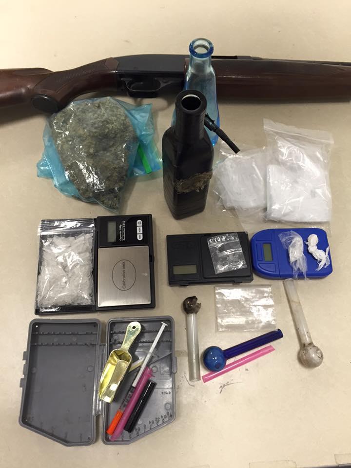 32 grams of methamphetamine, over 1/2 pound of marijuana, digital scales, baggies and a shotgun