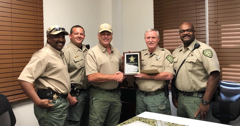 NCSO congratulates Deputy Gary Moran on his retirement with a plaque