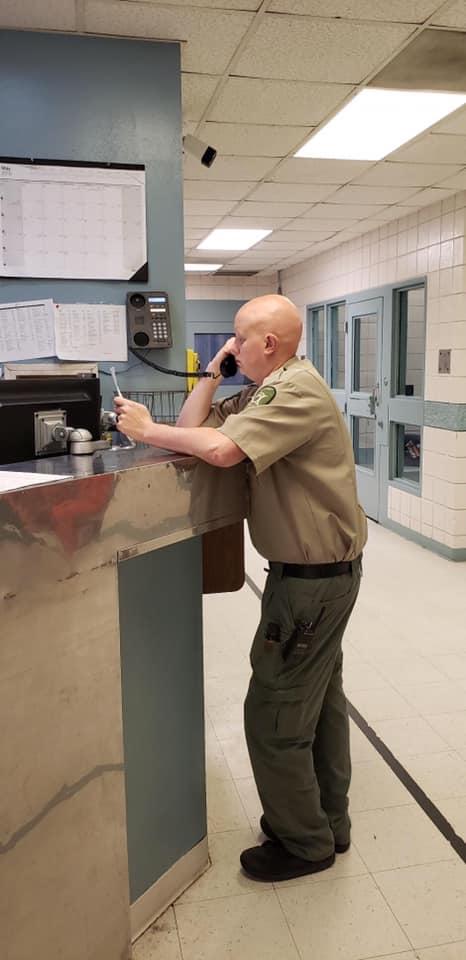 Corporal Alan Vitters seen calling for inmates to prepare them for transport to court