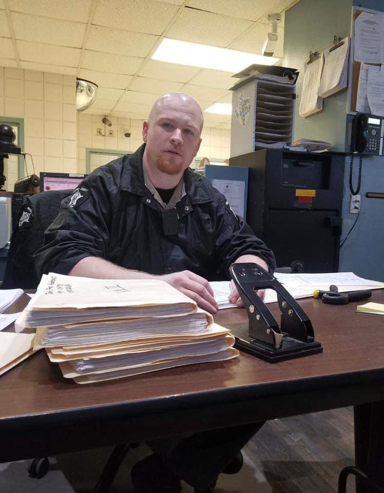 Cpl Sean Boggess reviewing inmate files