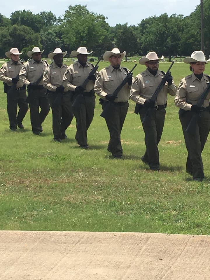 Parading with their rifles