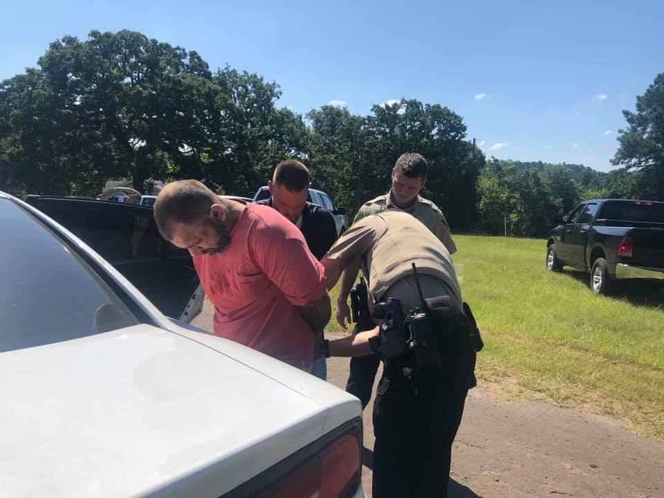 deputies taking suspect into custody