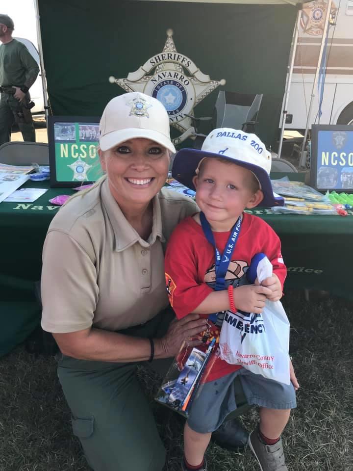 a little boy stopping by the booth