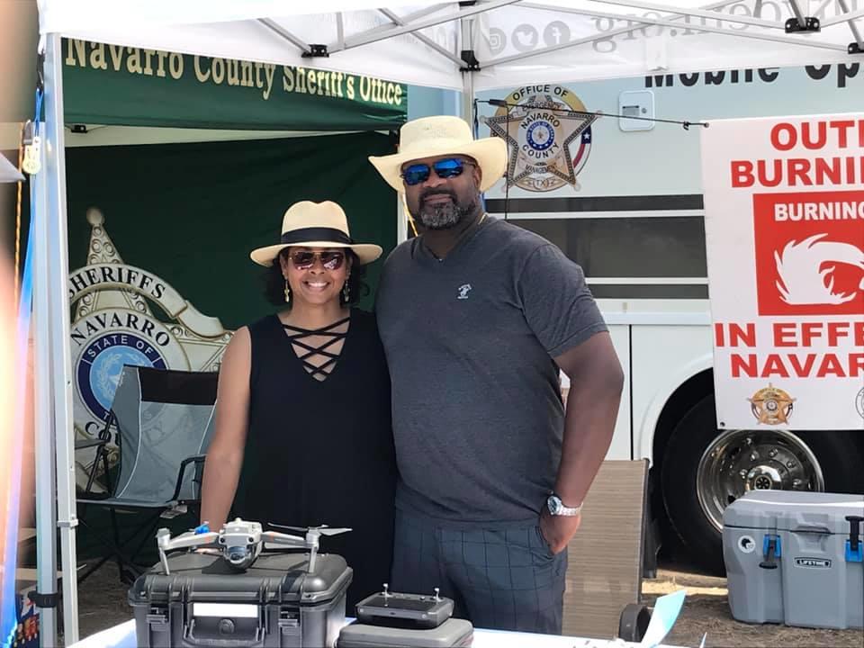 Navarro Co Sheriff Tent with a man and a woman in front