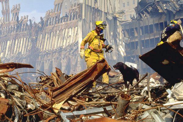 Firefighter standing on top of the rubble