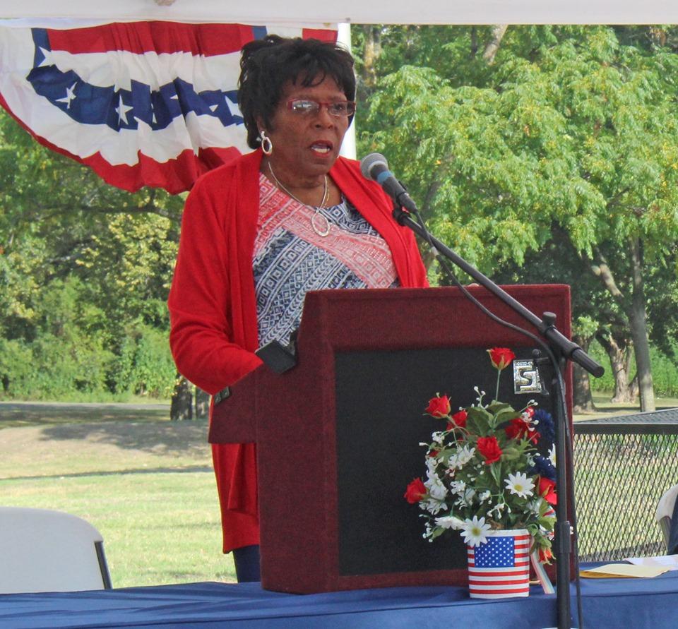 lady at a podium giving a speech