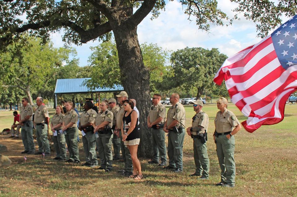 Group of people with flag flying in the foreground