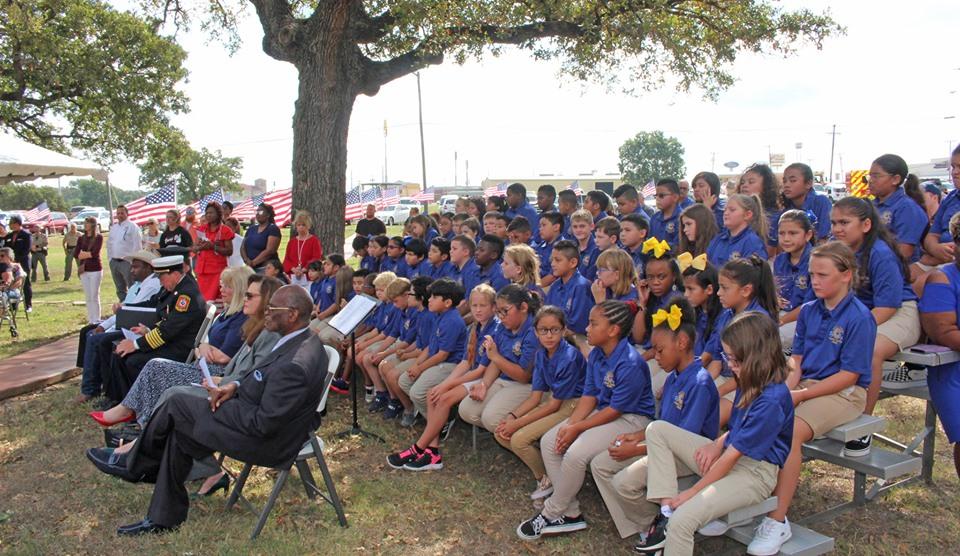 Children listening to a speaker