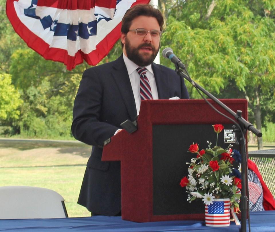 man at a podium giving a speech