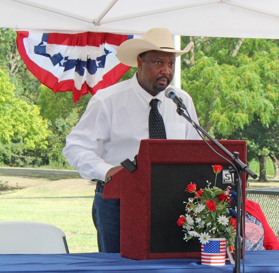 Man at the podium giving a speech