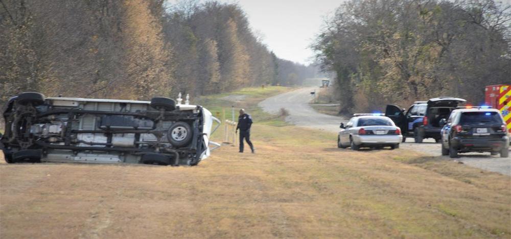 deputies on the crime scene showing a wrecked commercial van