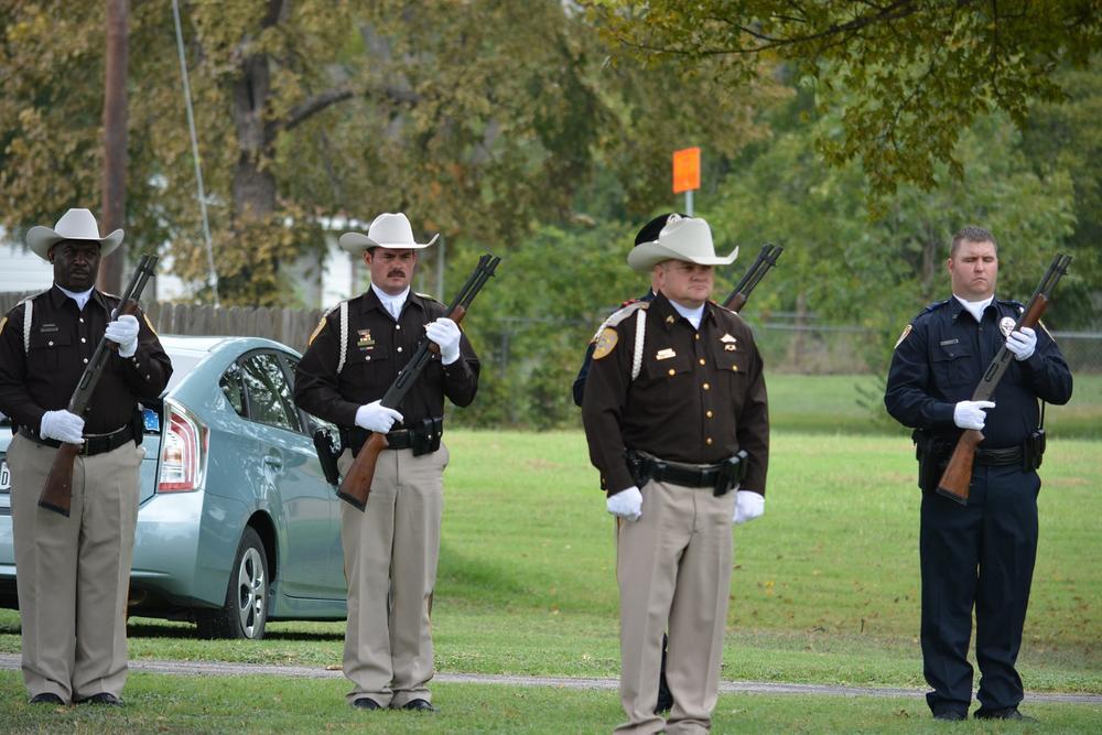 Deputies standing tall with shotguns in hand