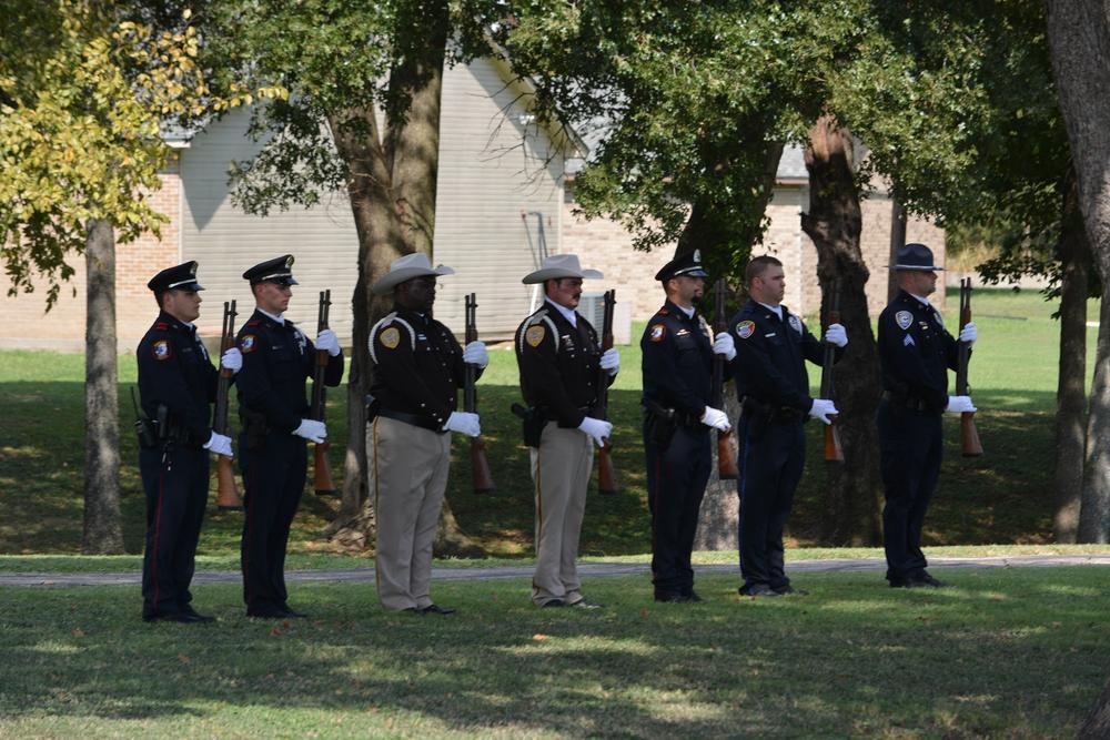 officers standing at the ready