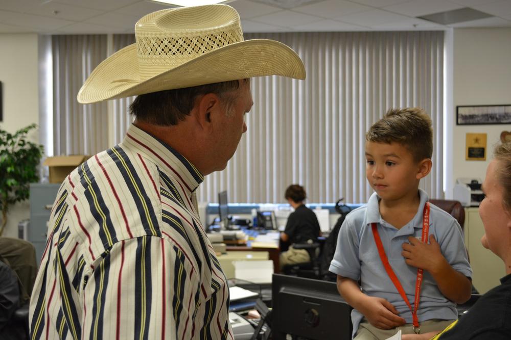 Eli Clagett listening to an officer