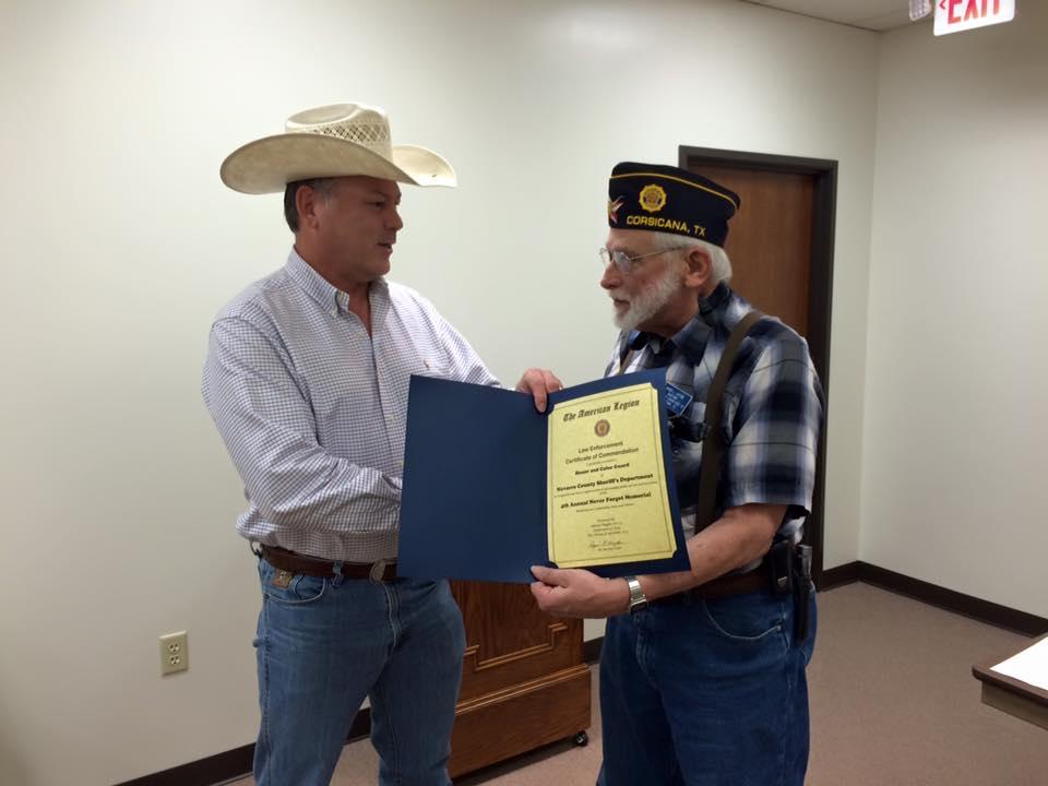 Roger Layton, right, of Corsicana American Legion Post 22, presents Navarro County Sheriff Elmer Tanner with a certificate of appreciation 