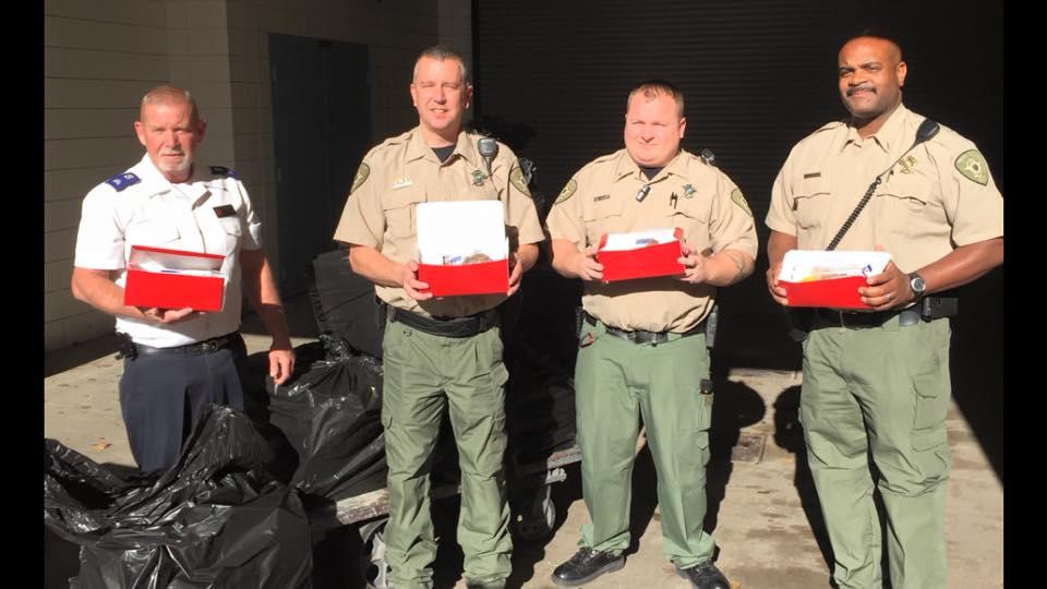 Detention Officers of the NCSO delivering gift packages to the inmates