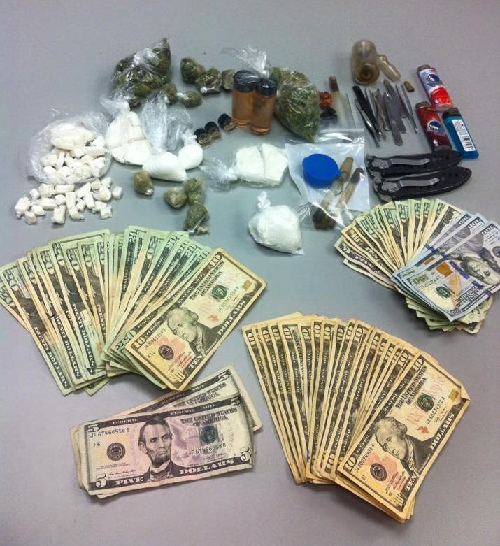 Cash, approximately 6 ounces of cocaine, and approximately 3.25 ounces of PCP and other various paraphernalia items 