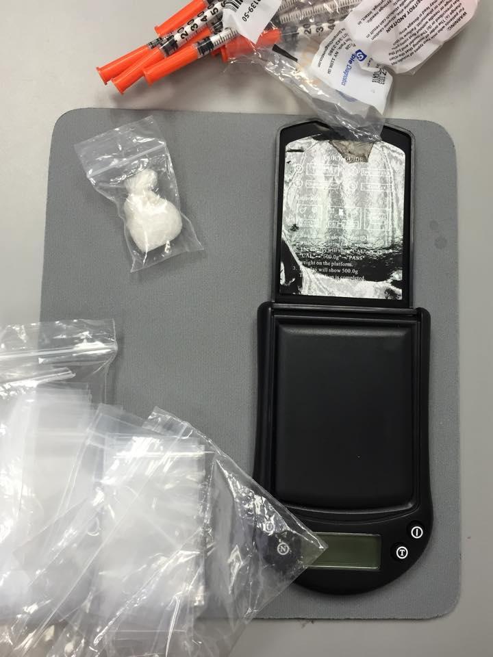 4 grams of methamphetamine, digital scales, baggies and syringes