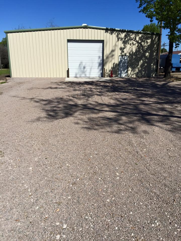 A freshly smoothed and graveled parking lot