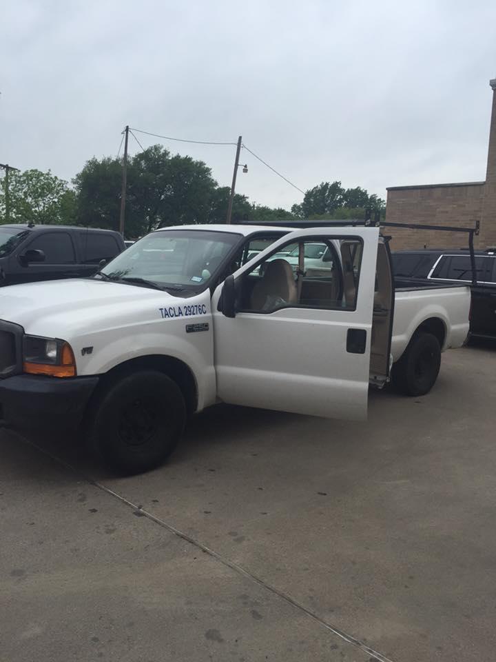 White pickup truck with driverside door open