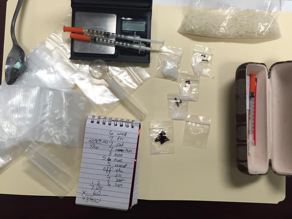 Over 4 grams of methamphetamine, digital scales, baggies and suspected drug records