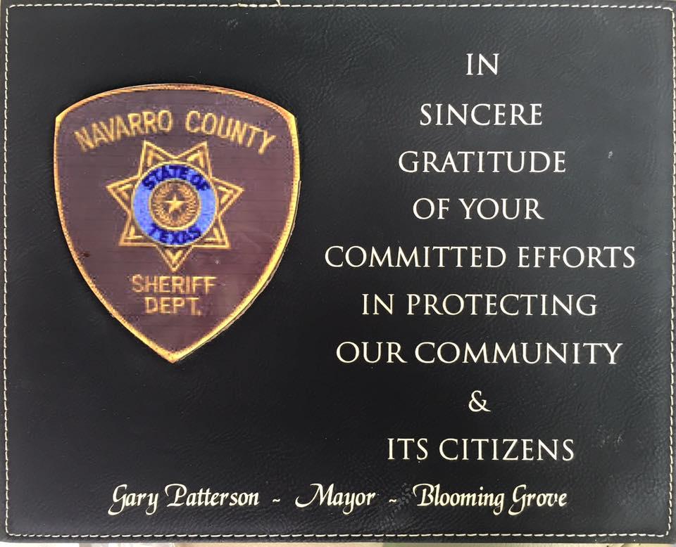 Plaque reads: " In sincere gratitude of you committed efforts in protecting our community and it's citizens.