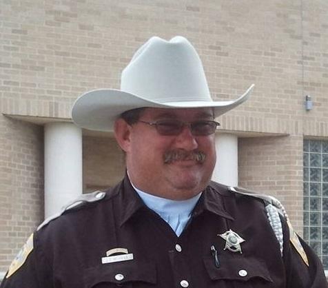 Deputy James Murray in his police uniform and cowboy hat