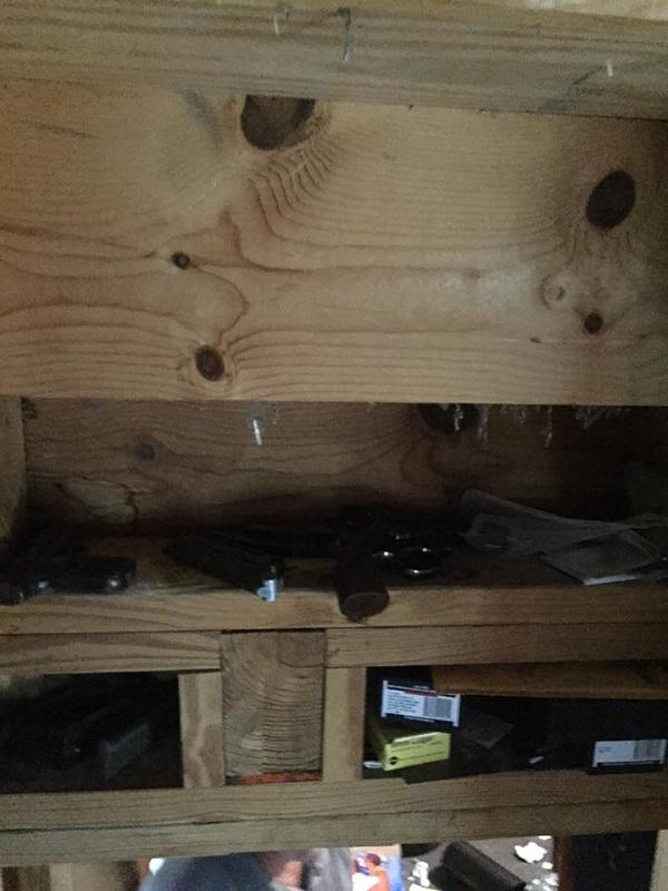 Multiple firearms and boxes of ammunition