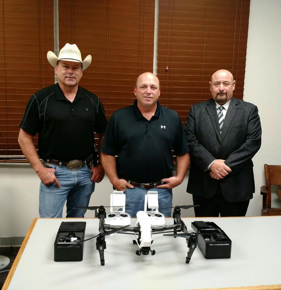 Sheriff Tanner and others stand next to their new drone