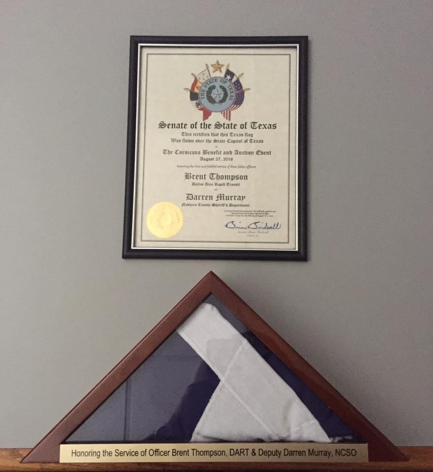  Texas flag that was flown over the State Capitol and the framed certificate