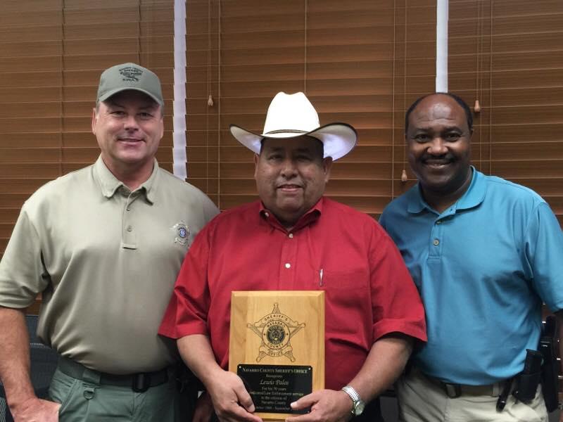 Sheriff Tanner stands with Reserved Captain Lewis Palos and other 