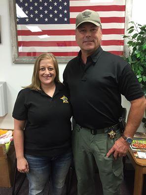 Alyssa Dunnahoe stands next to Sheriff Tanner