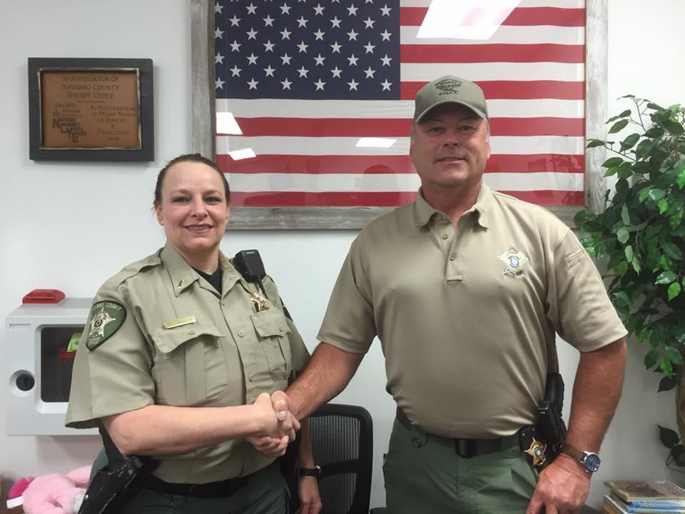 Gail Hurley shakes hands with Sheriff Tanner