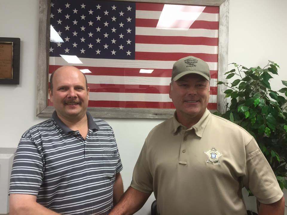 Dion Cardwell shakes Sheriff Tanner's Hand