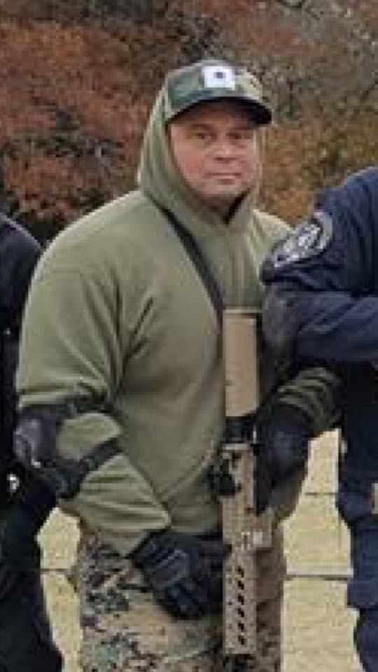 Deputy Eric Wilson holding his weapon