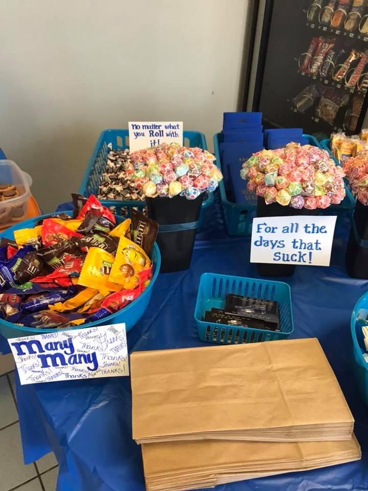 Lots of snacks and encouraging signs cover the table