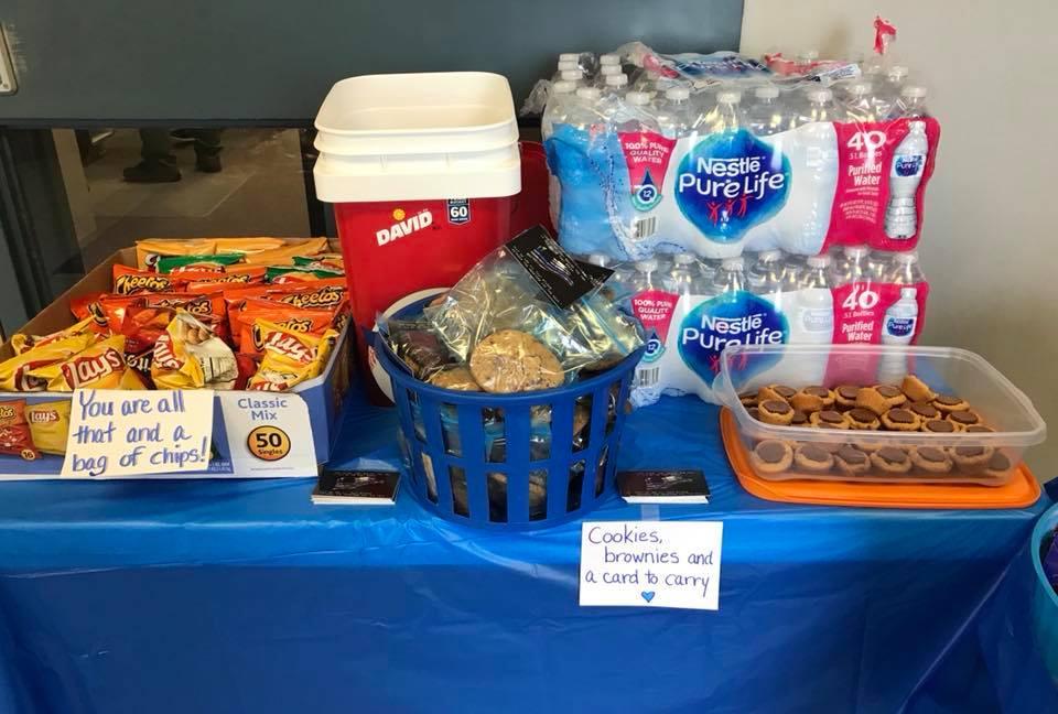 Chips, cookies, brownies and water bottles all laid out for the officers